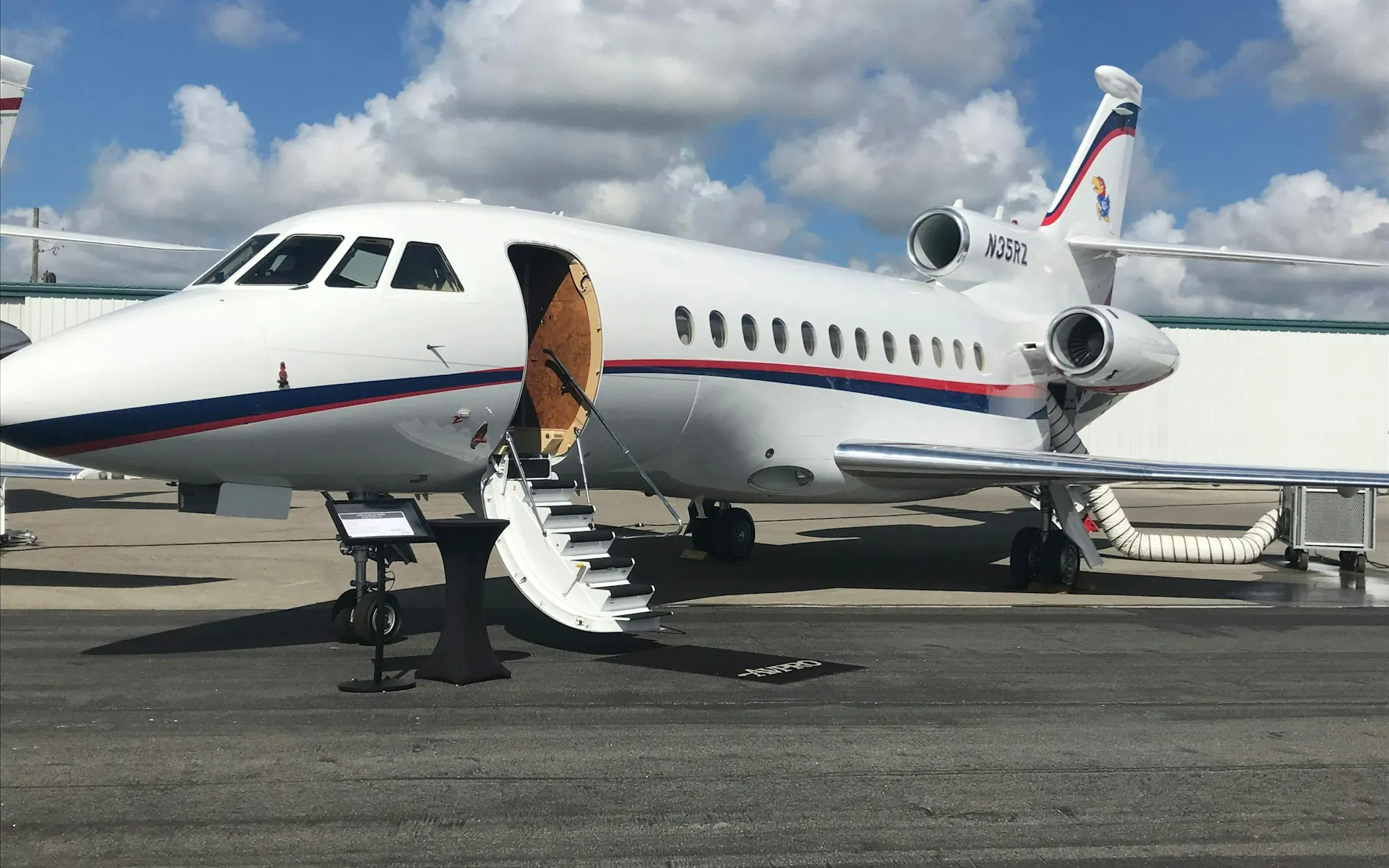 A private jet parked on a quiet runway